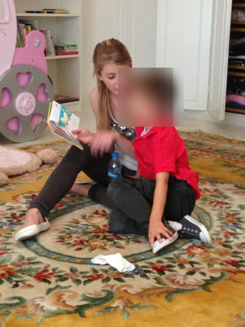 Sara reading with a child she nannied